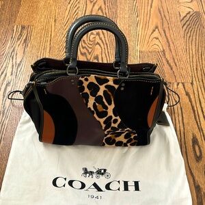 Coach Rogue top handle handbag in multi-color and animal print.